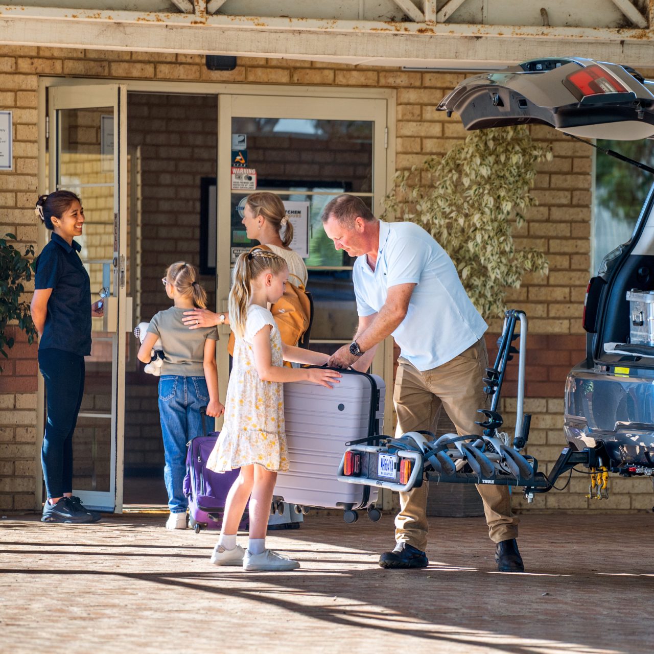 Picture of Family unloading suitcases out of their car for their stay at Drakebrook Hotel
